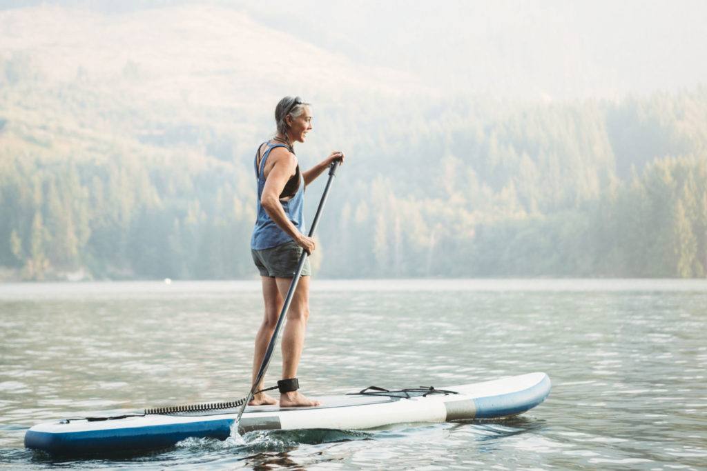 Beautiful Older Woman Paddleboard