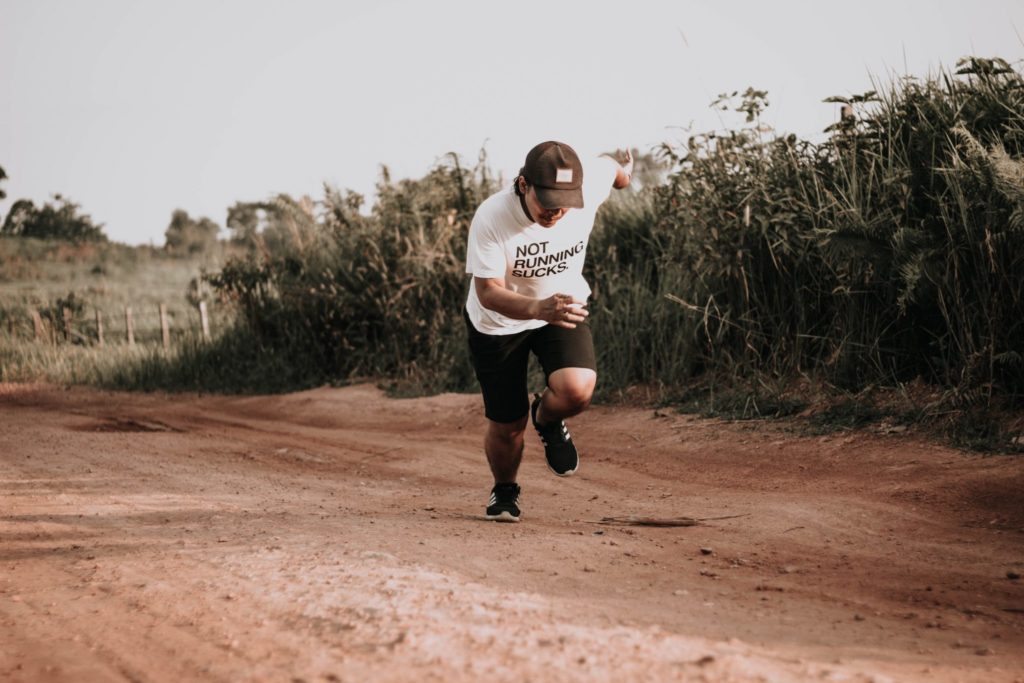 Man Sprinting Up Hill