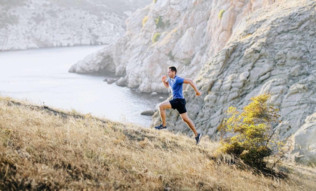 Man Sprinting Up Mountain