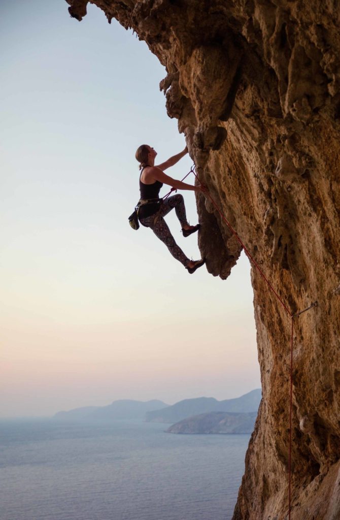 Woman Climbing Clifface Web