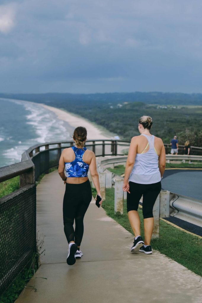 2 Women Walking Down The Path