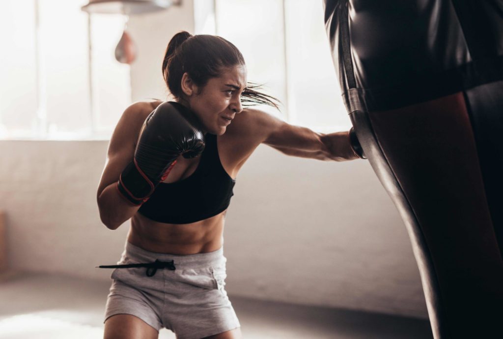 Woman Hitting Heavy Bag