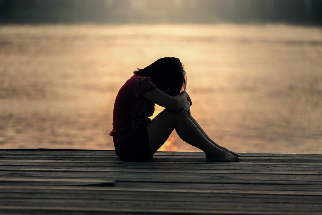 Depressed Girl On Dock