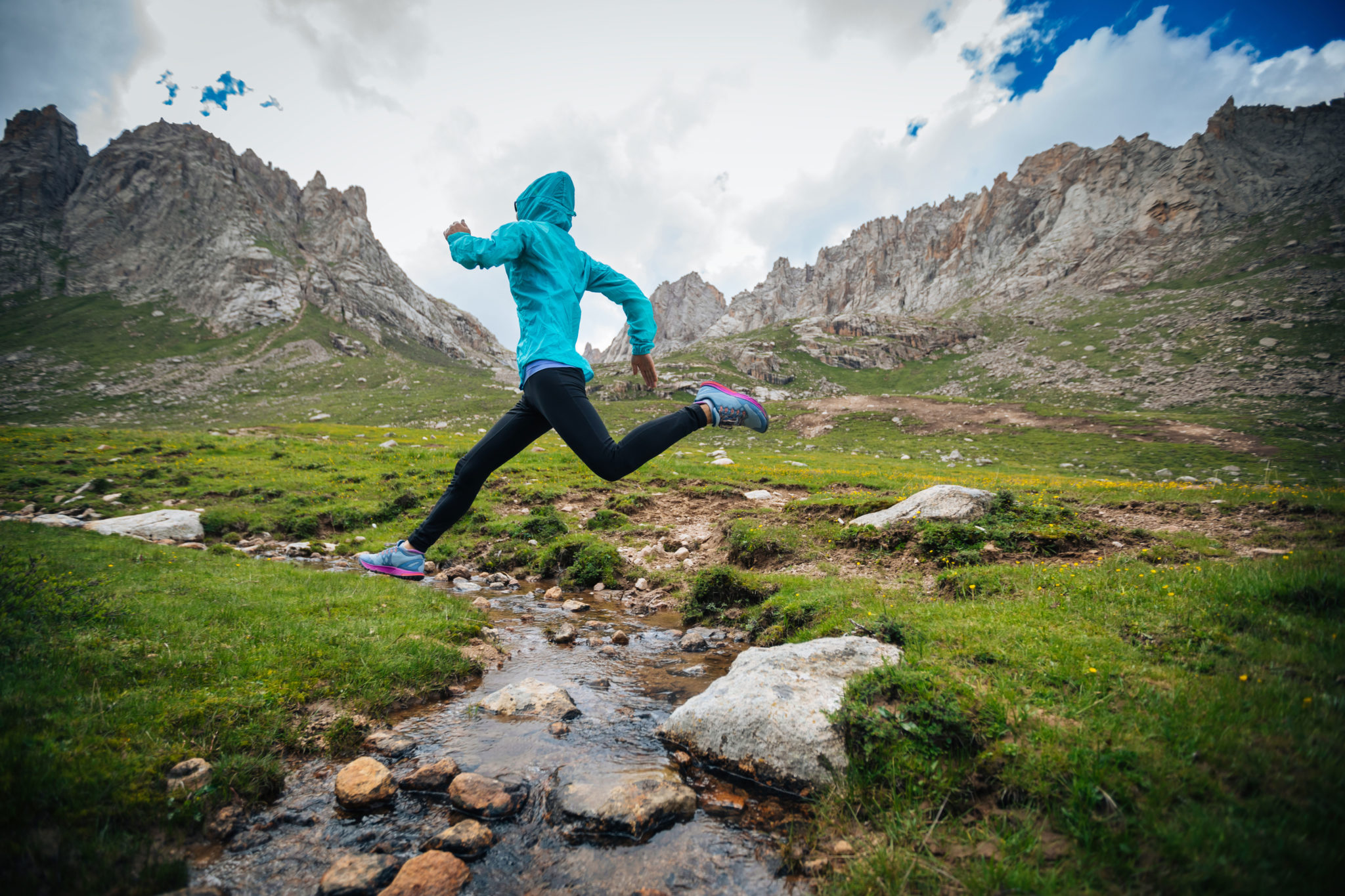 Woman Running In Mountains