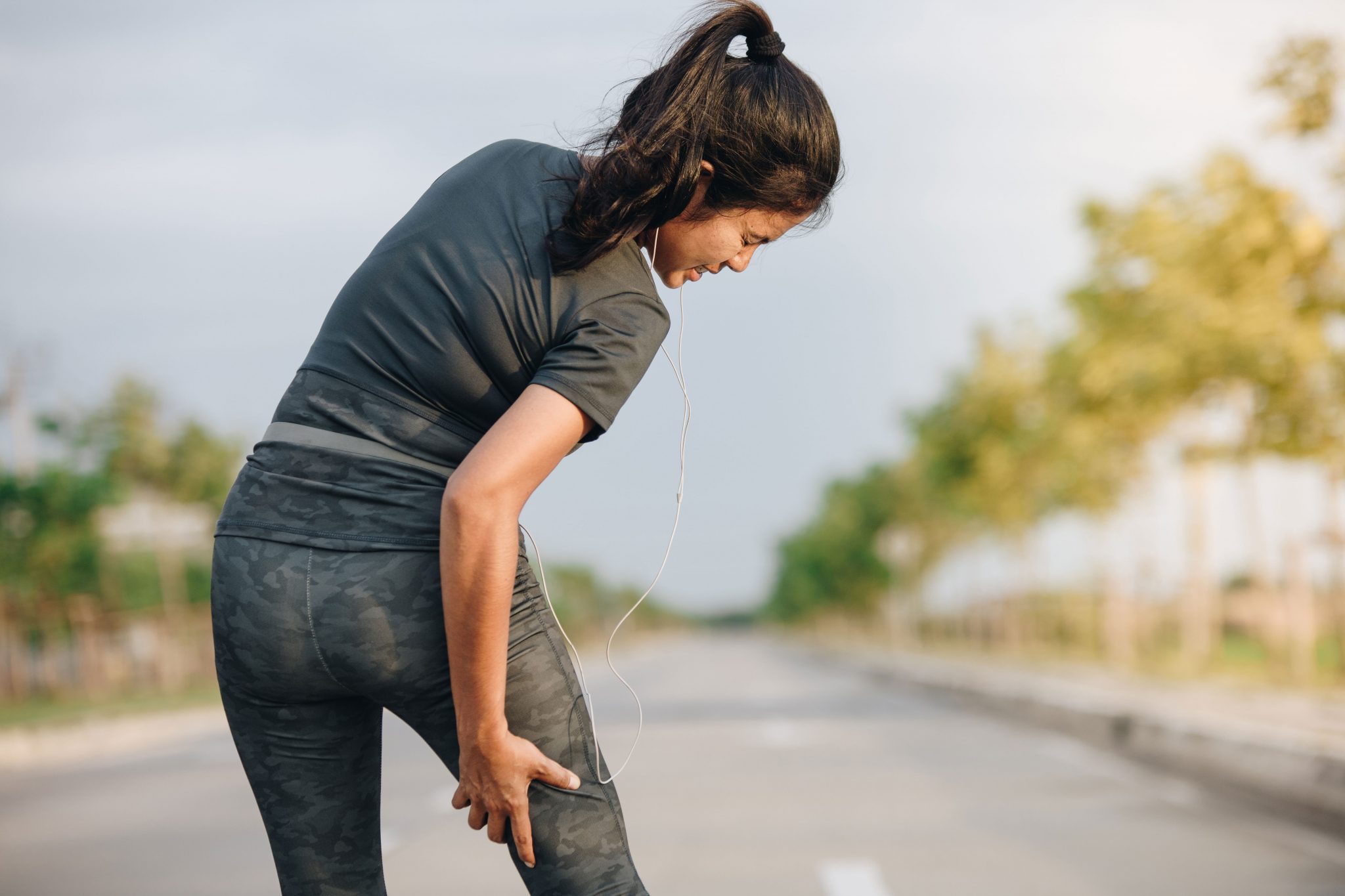Woman Jogger Hamstring Cramp
