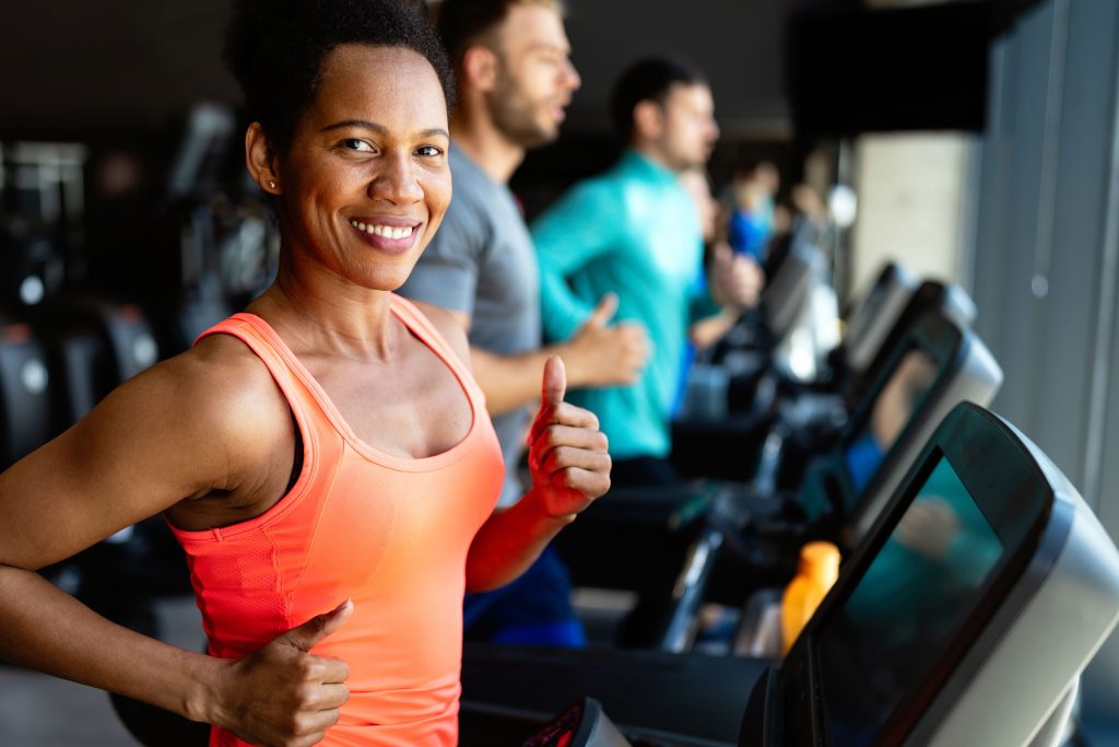 Beautiful Woman Running On Treadmill